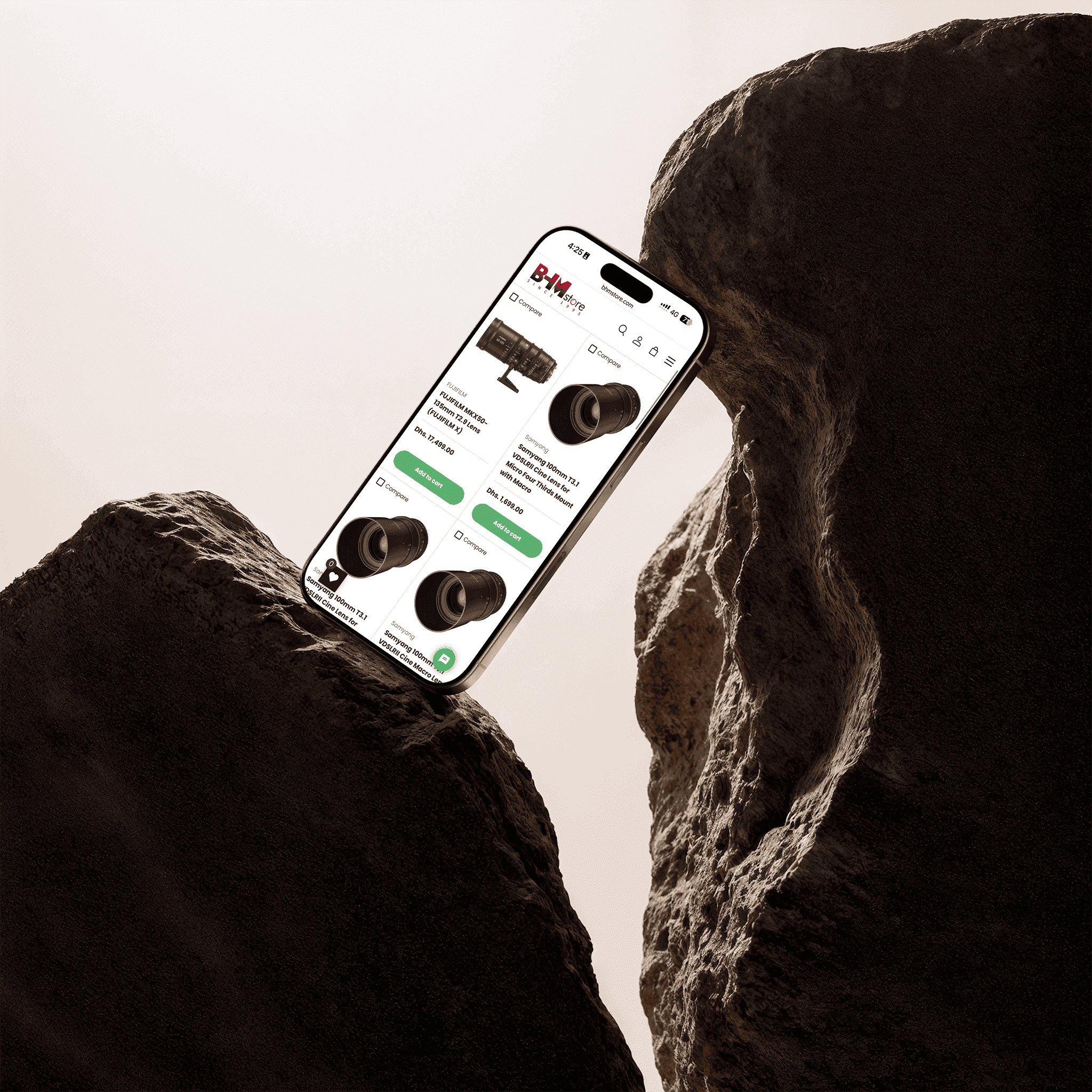 A BHM Store category listing on a phone: cine lenses at Dhs. 17,499.00 and Dhs. 1,699.00, each tile carrying a Compare checkbox and an Add to cart button.